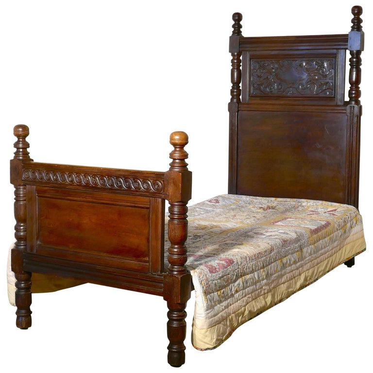 A Magnificent Fully Carved Antique French Gothic BedStripped Oak