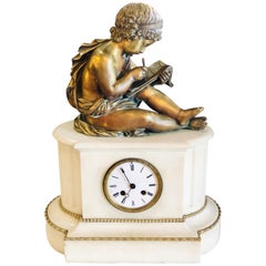 19th Century Figural School Boy Bronze Sitting Atop a Marble Mantle Clock Base