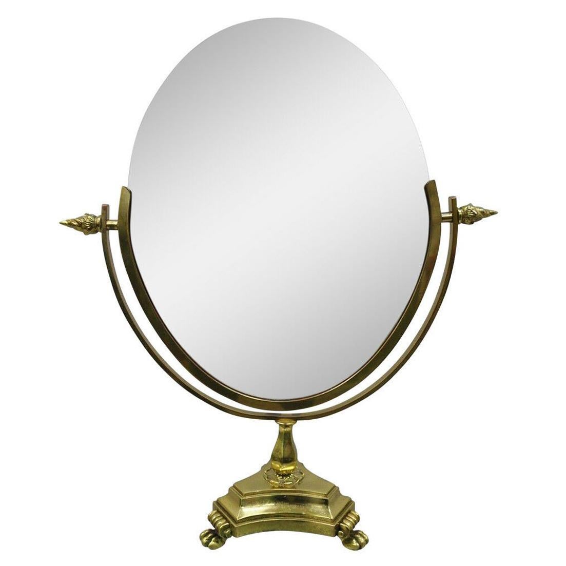 Ancien miroir de coiffeuse ovale de style Empire français à pieds en laiton et à double miroir en vente