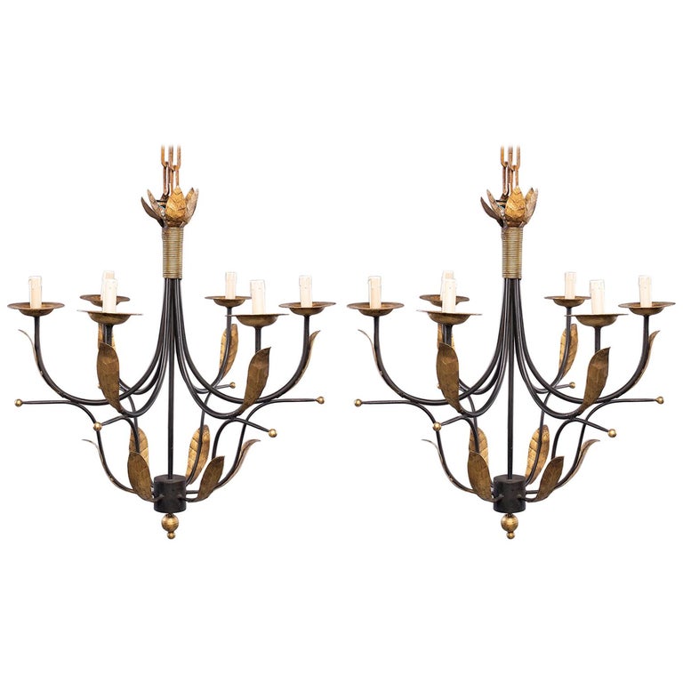 Pair Of Mid Century Spanish Iron And Gilt Metal Six Light Pair Of Mid Century Spanish Iron And Gilt Metal Six Light Chandeliers For