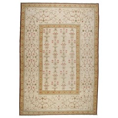 Tapis à fleurs doré et beige