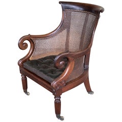 Antique English Bergere Armchair of Caned Mahogany from the Regency Period