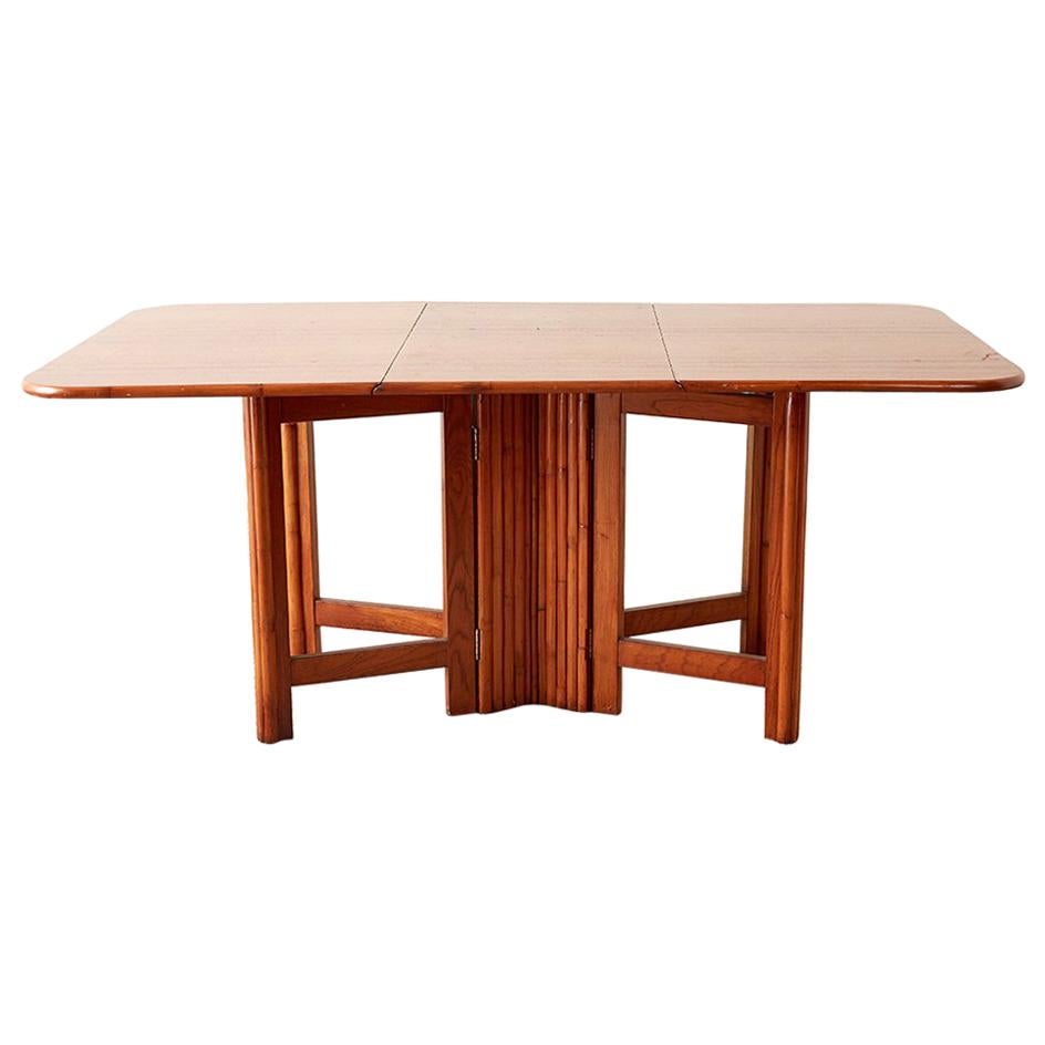 Midcentury Drop-Leaf Dining Table with Rattan Base For Sale