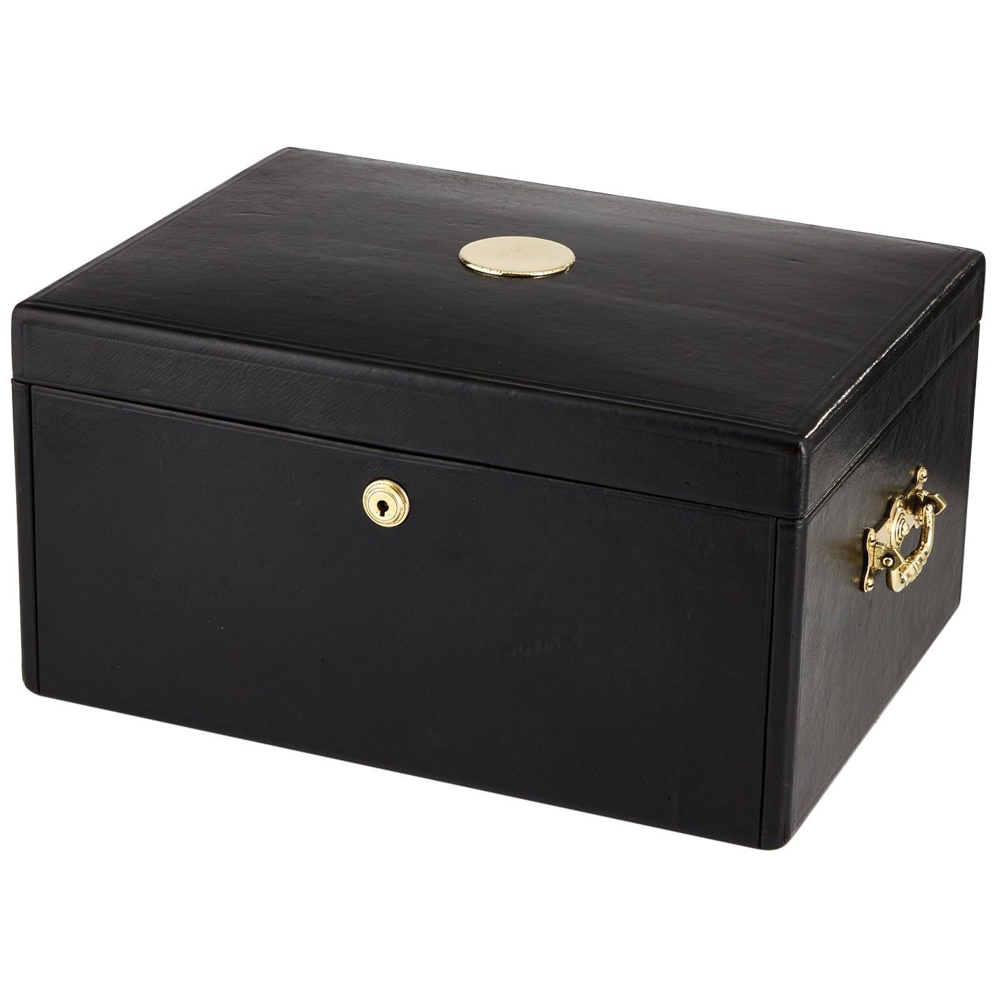 A stunning early 20th century black leather document box, circa 1910.
This box could serve as jewel box or for a watch collection having multiple lift out trays as shown, lined in suede and velvet.
The lid hinges completely back which acts as a