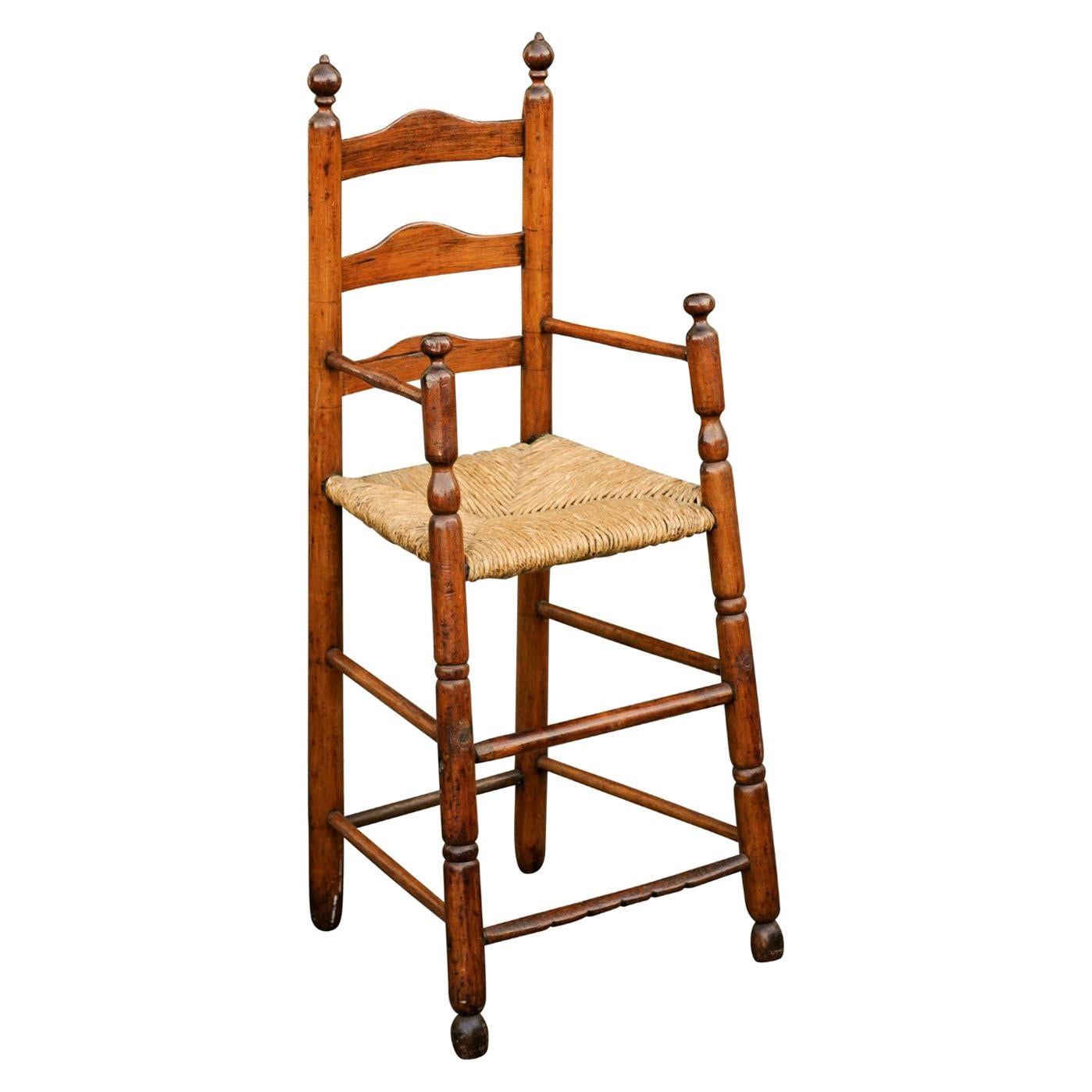 American Rustic Pine Child's High Chair with Rush Seat, Early 20th Century For Sale
