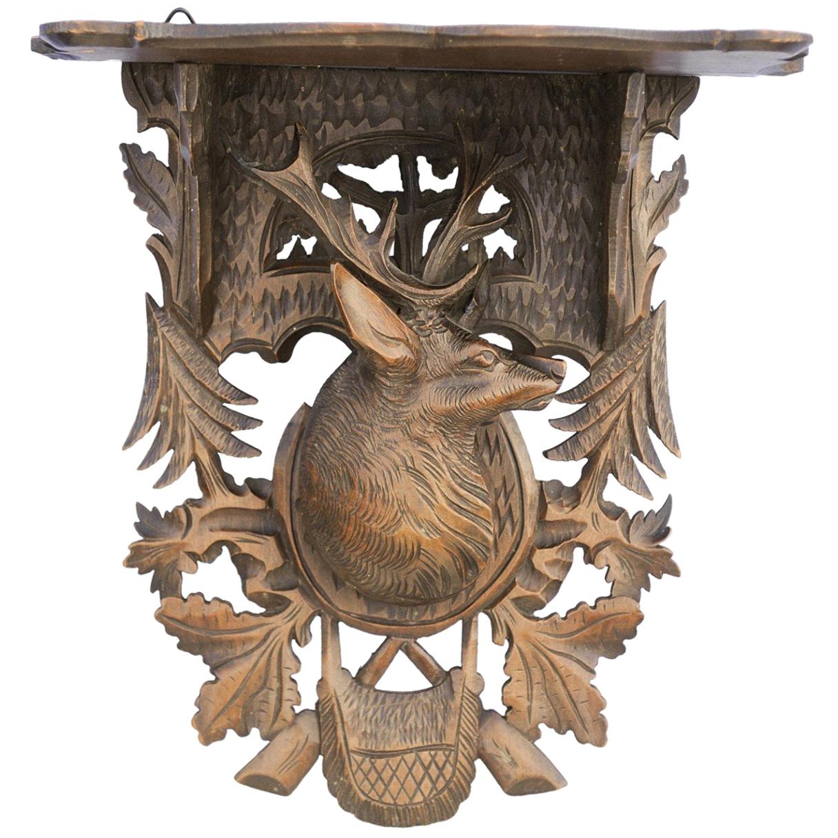 Black Forest 1920s Oak Wall Bracket from Switzerland with Hand Carved Stag Motif For Sale