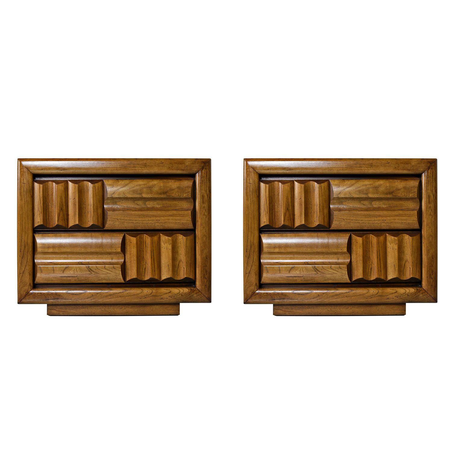 Mid-Century Modern Brutalist oak nightstand end tables, circa early 1970s. Thick, sculpted, contrasting and intersecting bands of solid oak adorn the fronts. This look exemplifies the Brutalist aesthetic. Bold, monumental form is sure to make a