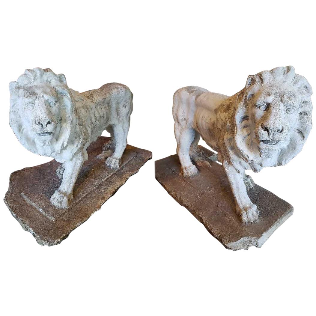 Pair of Exceptional Opposing Cement Lions with Hand Scraped Finish For Sale