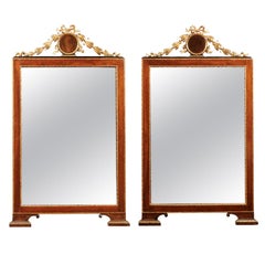 Pair of 19th Century Italian Neoclassical Style Walnut and Parcel Gilt Mirrors