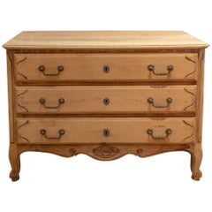 Antique French Stripped Wood Three-Drawer Commode with Carved Details