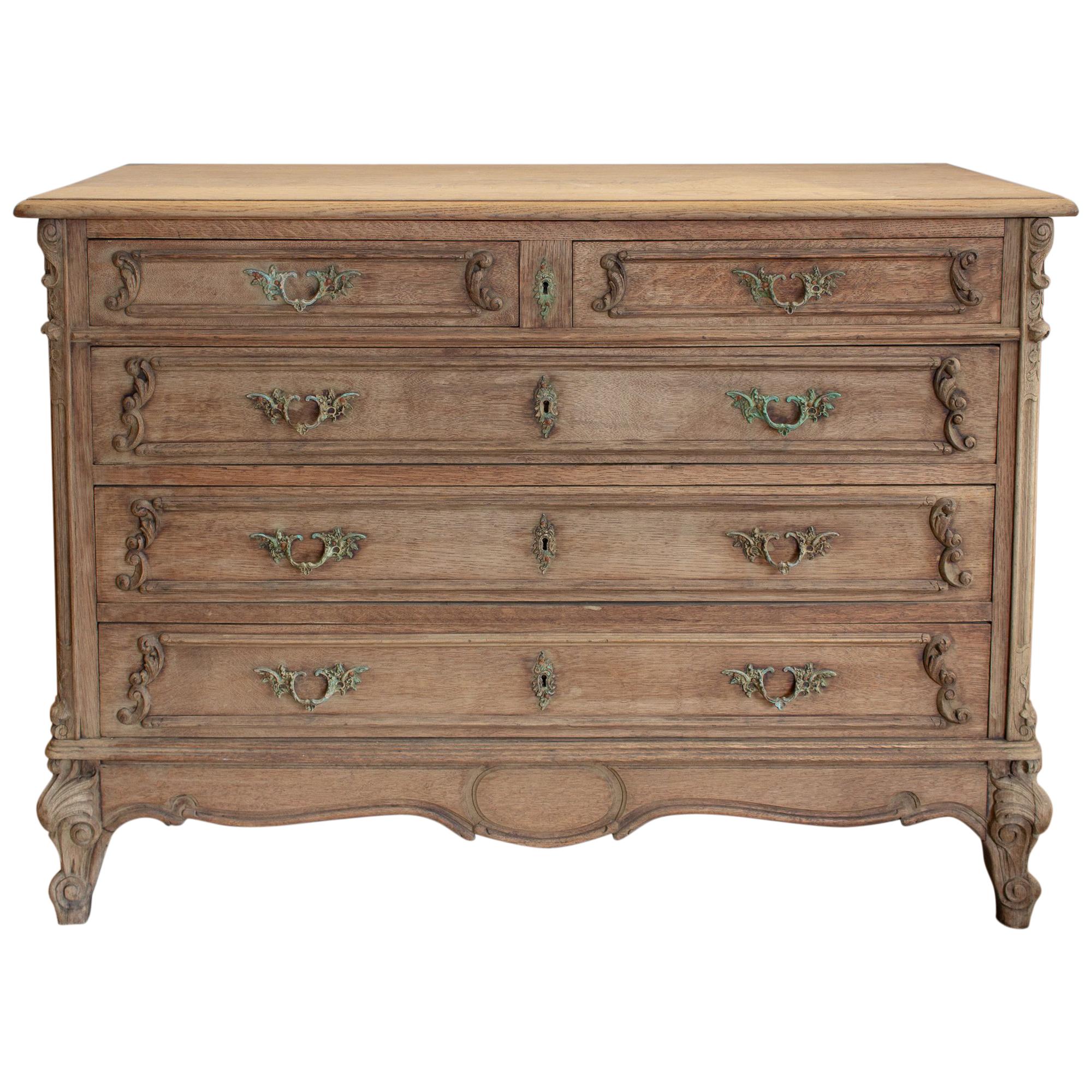 Antique French Stripped Wood Five-Drawer Commode with Detailed Carvings