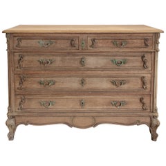 Antique French Stripped Wood Five-Drawer Commode with Detailed Carvings