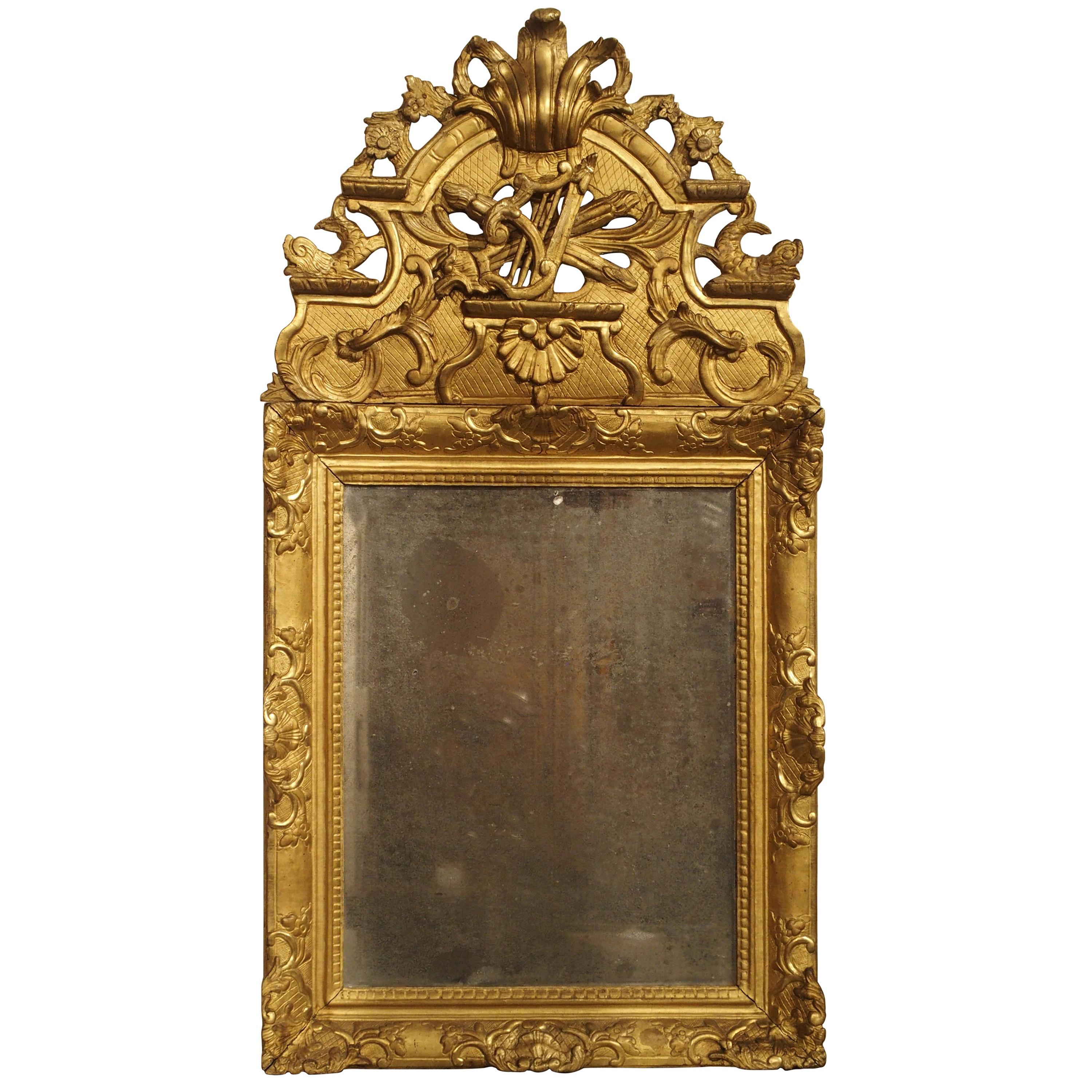 Miroir d'époque Régence française en bois doré, vers 1720