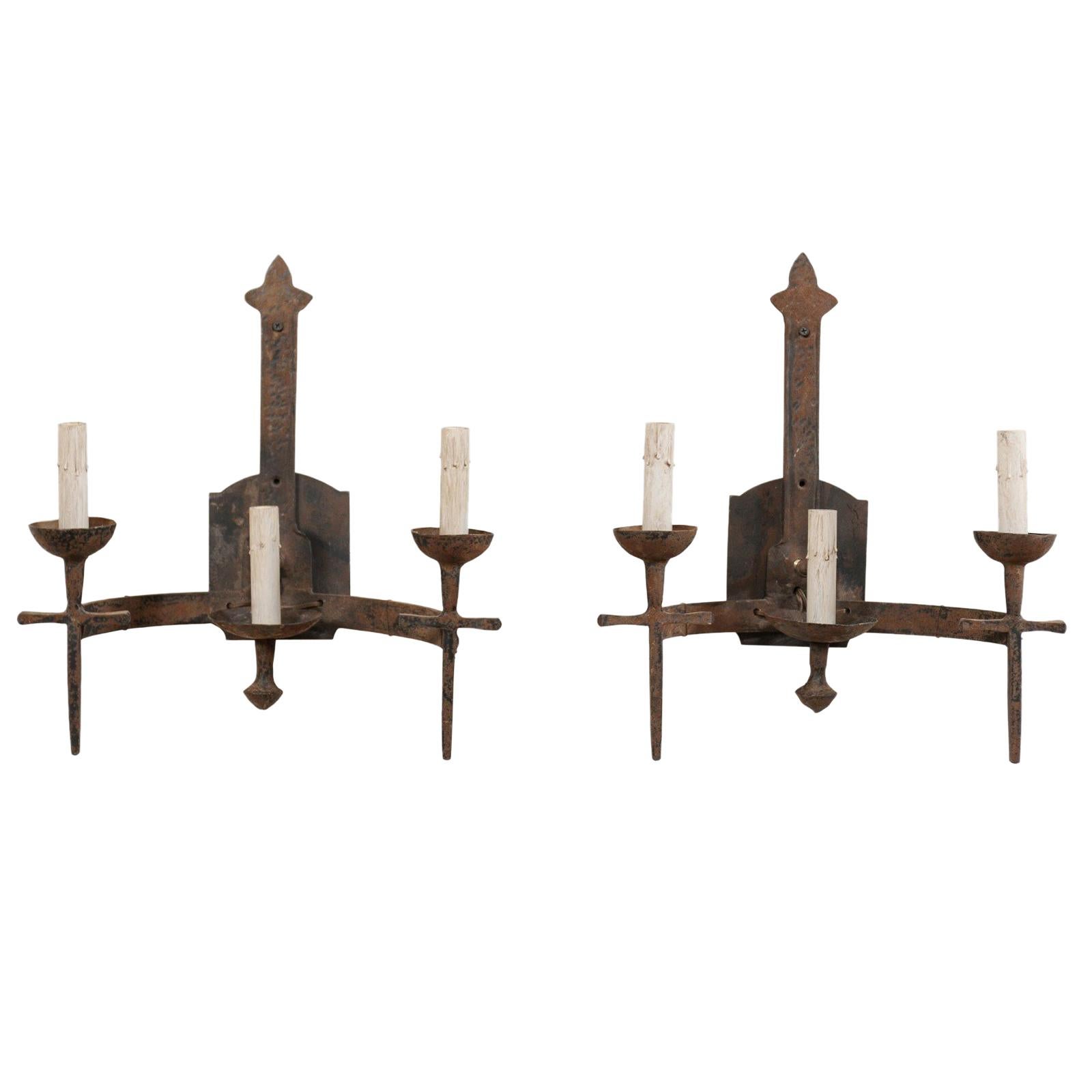 Pair of French Three-Light Midcentury Torch-Style Iron Sconces For Sale