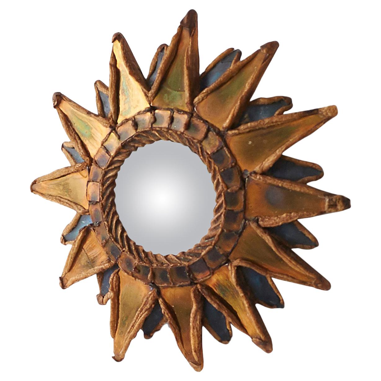 Small “Pointed Sun” mirror by Line Vautrin
A unique mirror completely handmade by Line Vautrin using Talosel resin with mirror inlays and a convex mirror. Signed by the artist, 
France, circa 1955-1965.