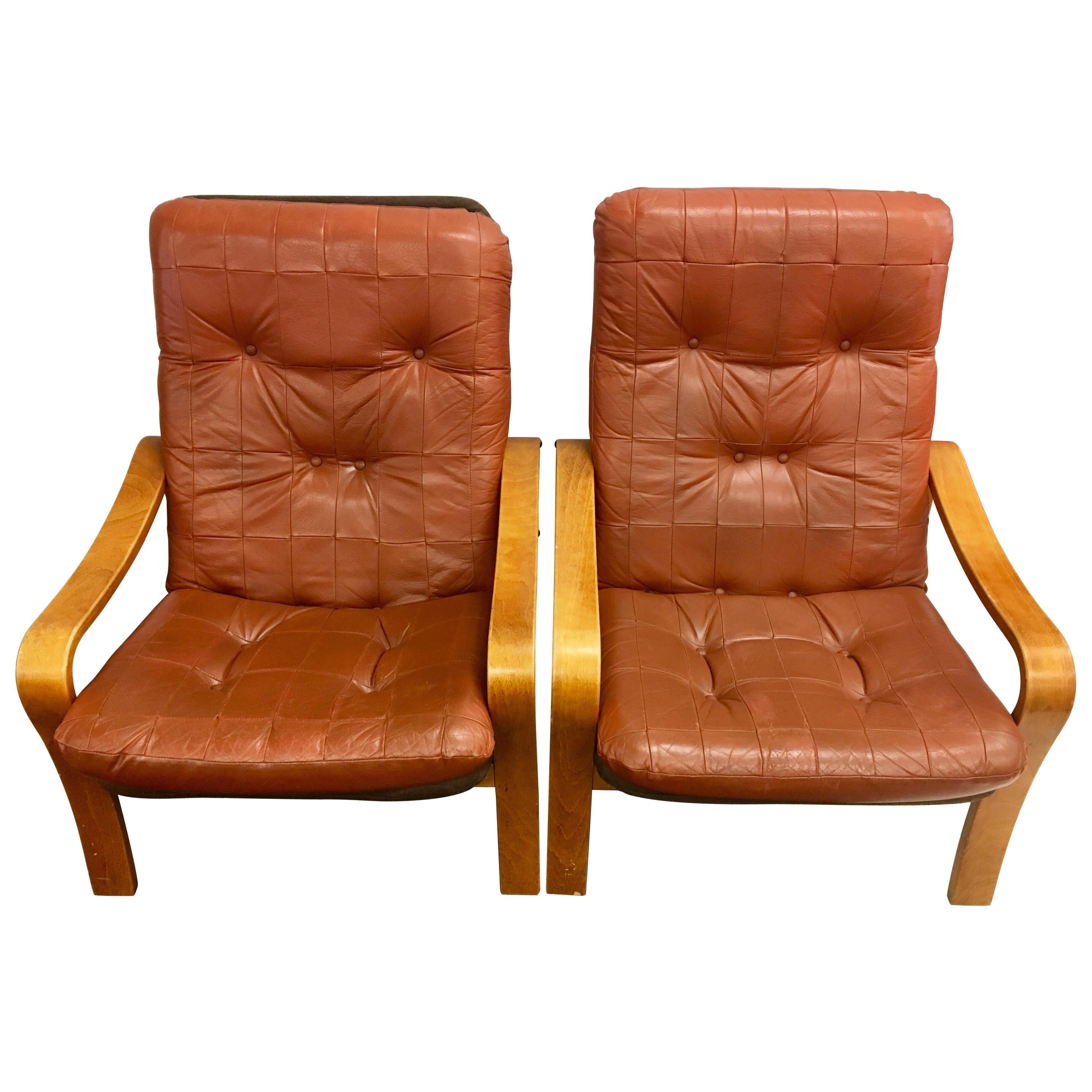 Pair of Danish Modern Teak and Tufted Leather Lounge Chairs
