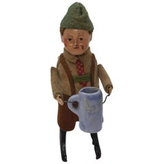 Schuco Tin Wind Up Young Man Drinking from German Bisque Stein, circa 1930