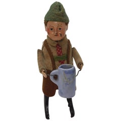 Vintage Schuco Tin Wind Up Young Man Drinking from German Bisque Stein, circa  1930