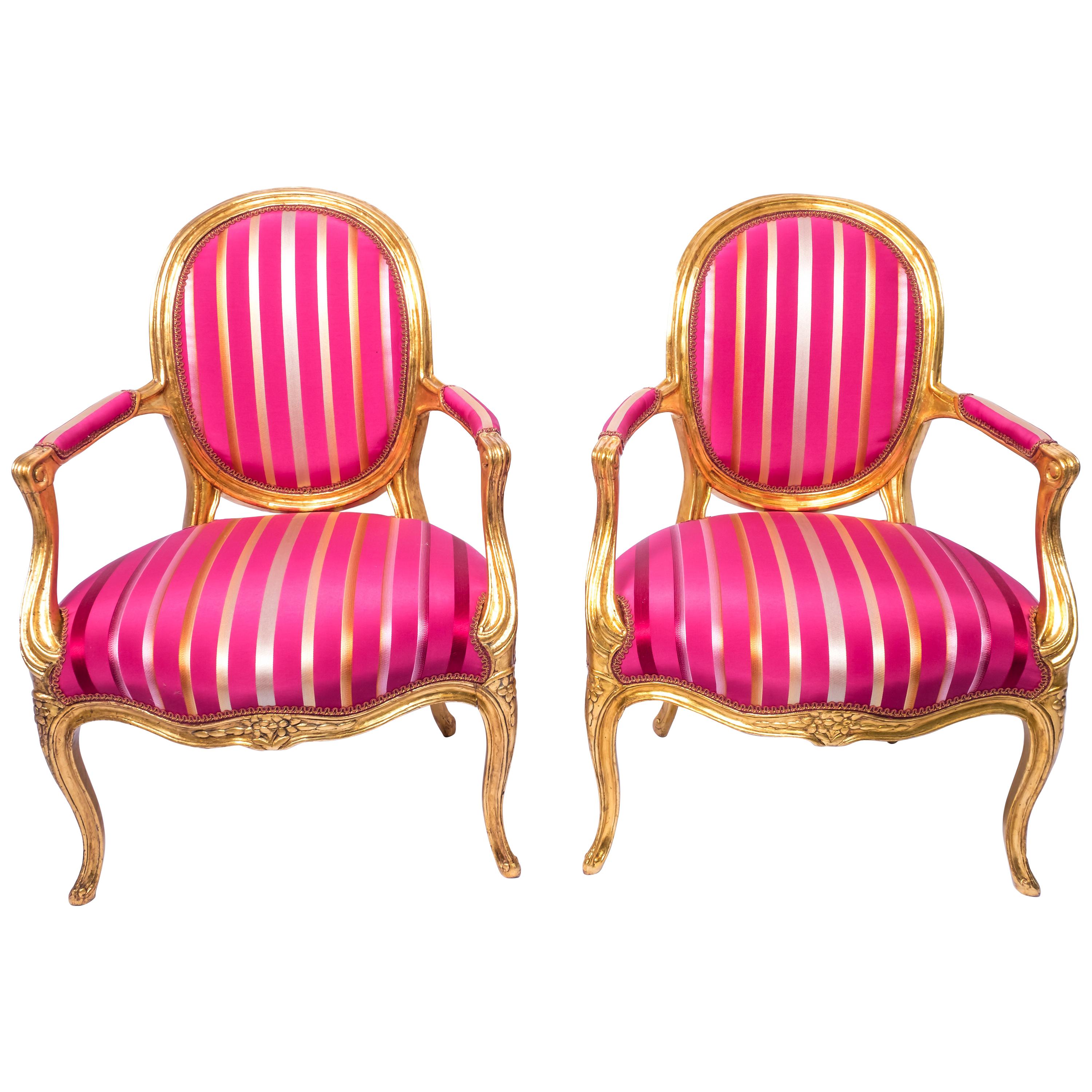 *B Pair of Louis XVI style magenta armchairs. French, early 20th Century.