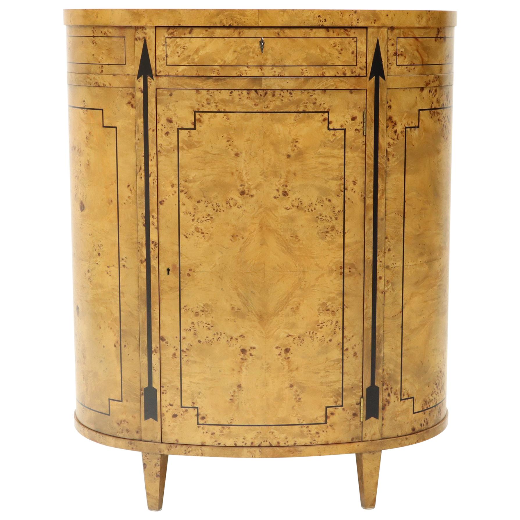 Biedermeier or neoclassical style oval round cylinder shape burl wood liquor cabinet utility chest storage. Finished back makes it a good looking centrepiece. Nice black accent arrows pointing upwards.