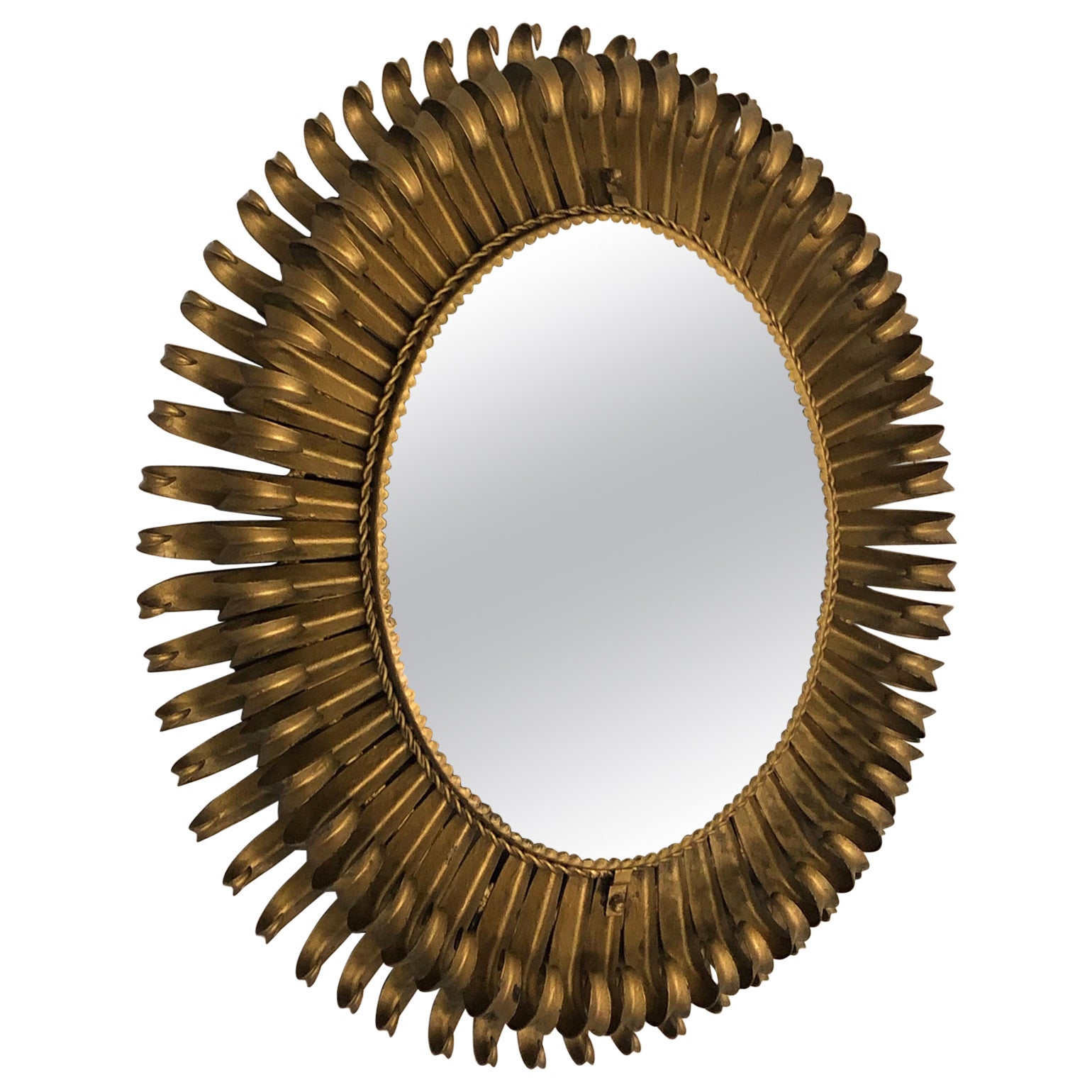 Miroir Sunburst néoclassique français moderne ovale et fer doré, Gilbert Poillerat en vente
