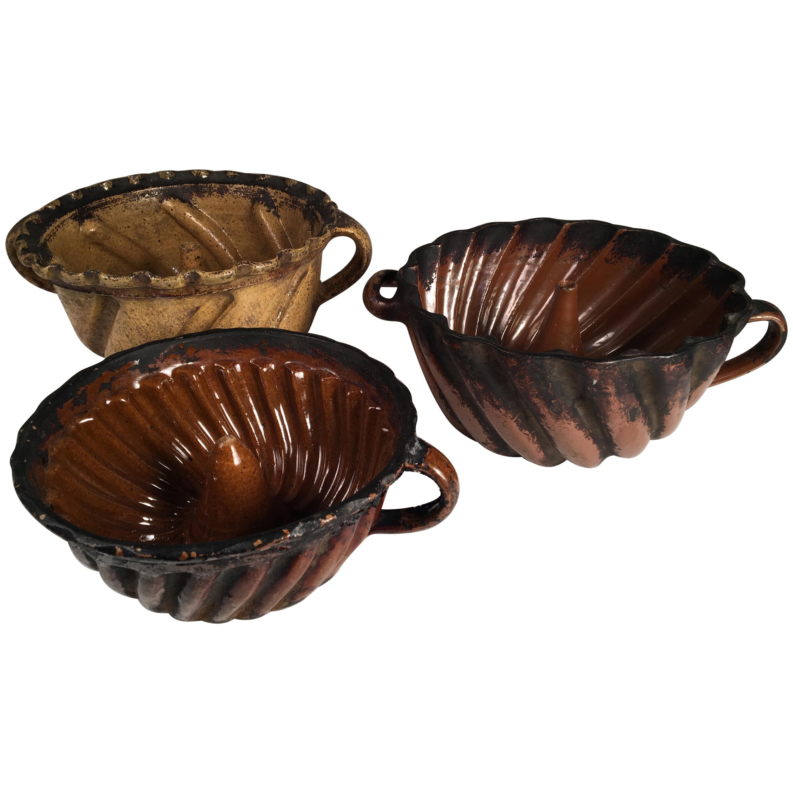 Collection of 3 Pennsylvania Redware "Turk's Head" Cake Molds, 18th Century