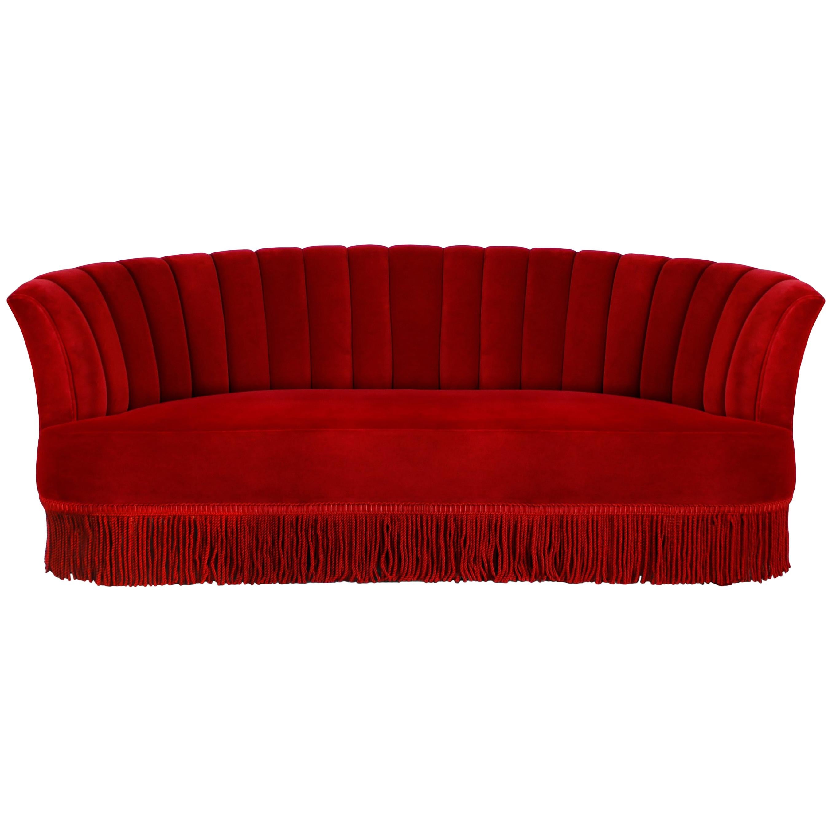 Inspired by wild, passionate nights of the Spanish dance, the Sevilliana sofa design embodies the graceful curves and attire of Sevillana dancing girls. Become entranced in the movement of modern lines drawing your eye down to the flirtatious fringe
