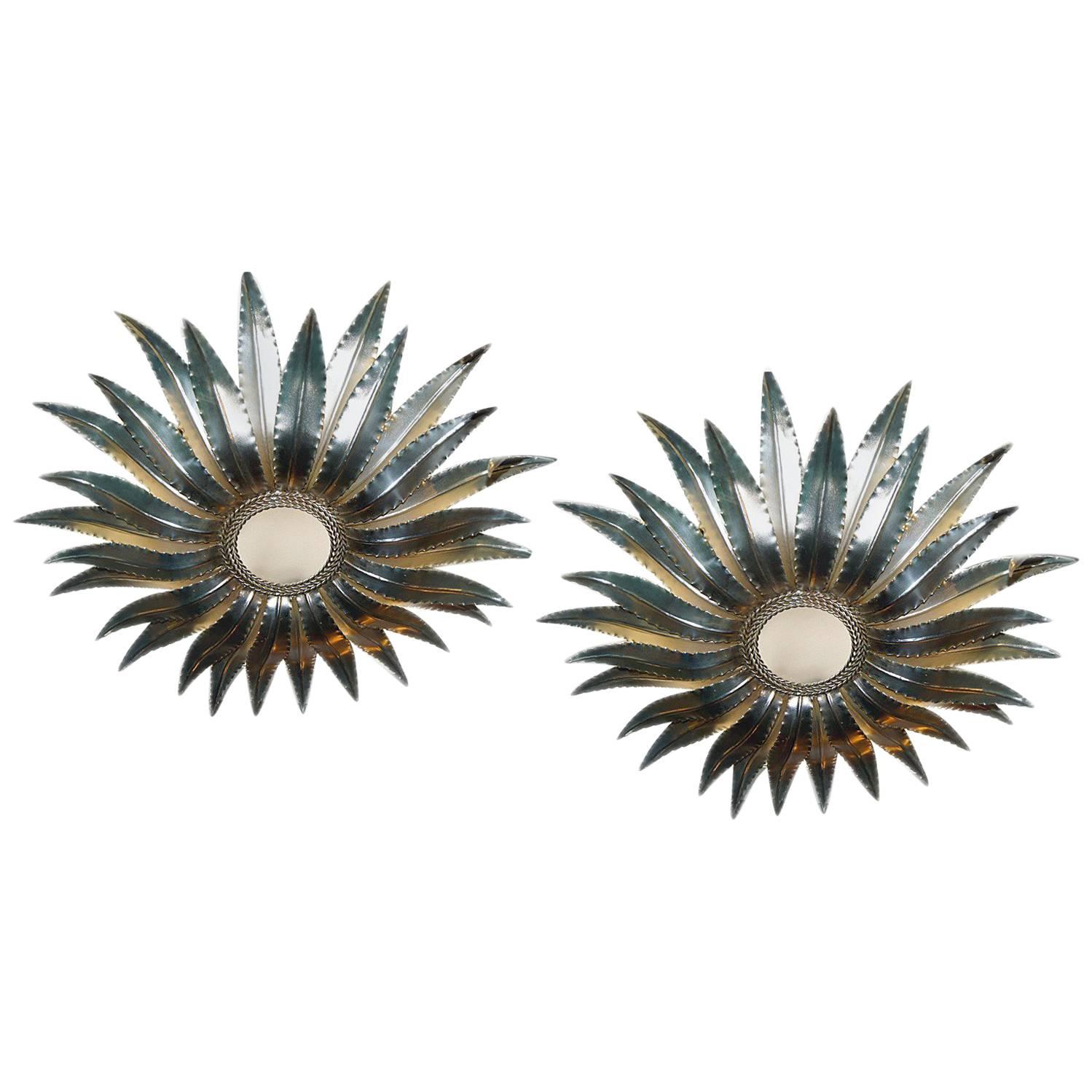 Pair of late circa 1940's Italian silver plated sunburst light fixtures with frosted glass insets. Sold Individually.

Measurements:
Drop: 7