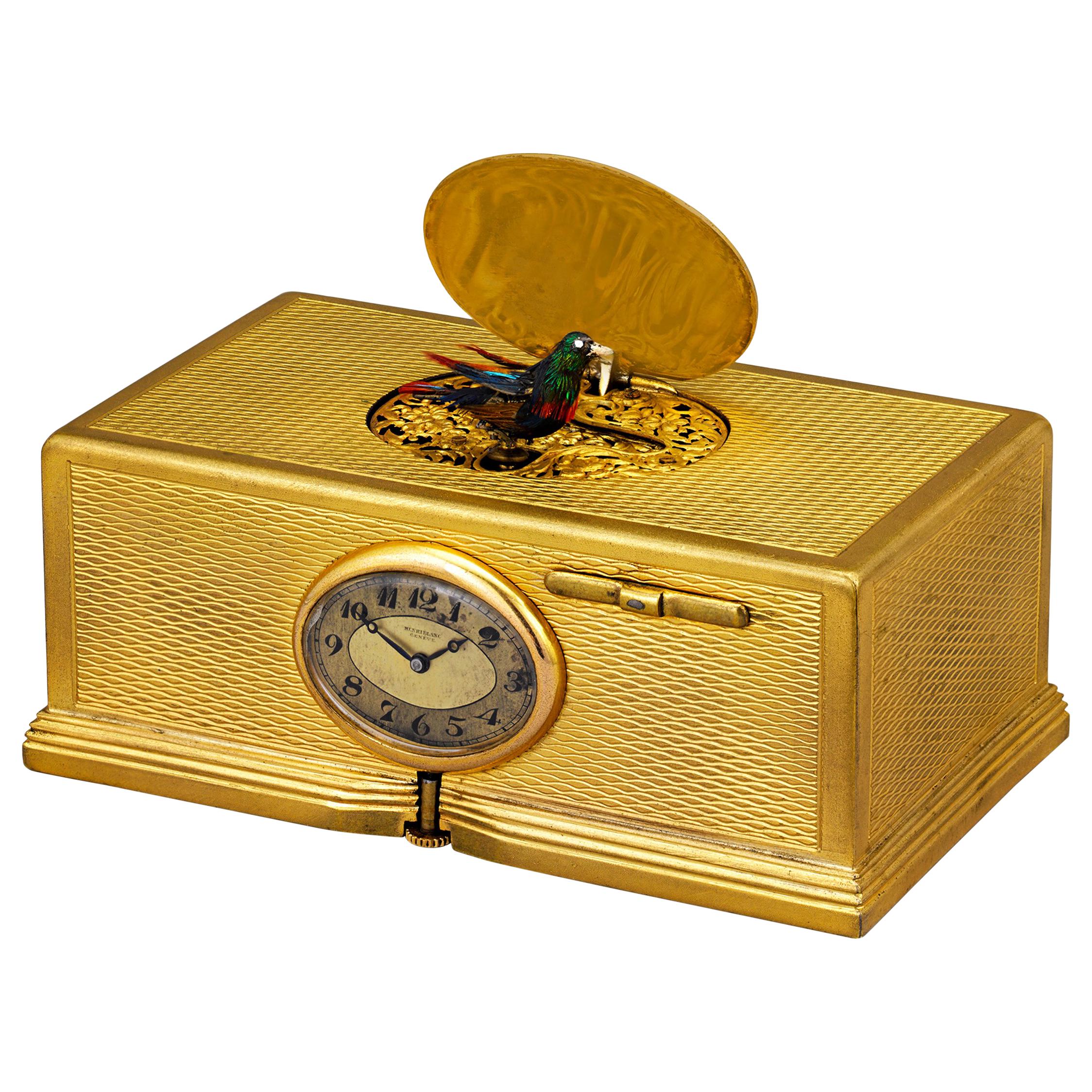 Boîte à oiseaux et horloge chantante plaquée or