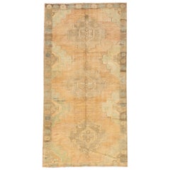 Tapis Khotan antique fait main en laine couleur pêche