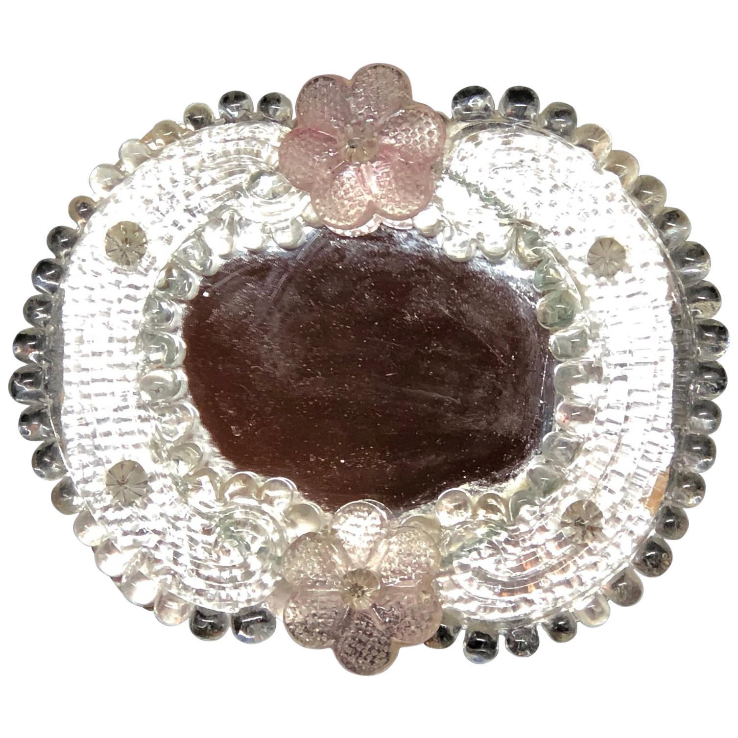 A gorgeous petite Murano glass vanity mirror surrounded with handmade light pink flowers. Can be used as a wall mirror. With minor signs of wear as expected with age and use. A nice addition to any girls or ladies room.