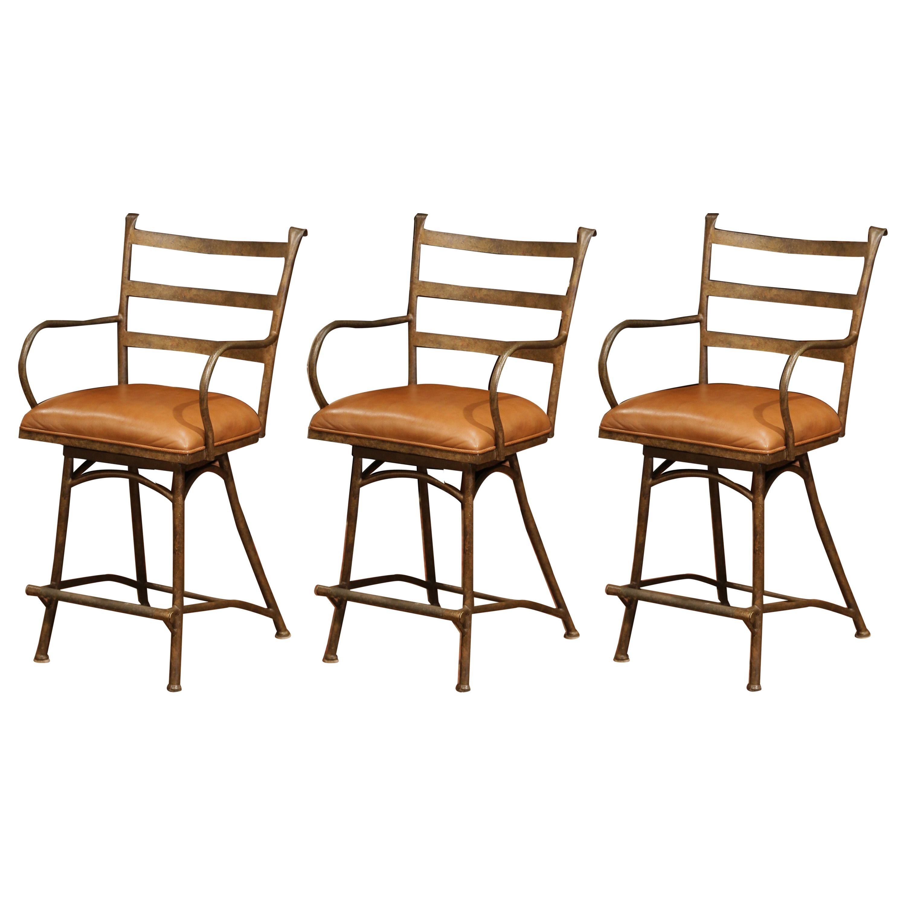 Set of Three French Rust Iron Swivel Stools with Brown Leather Seat