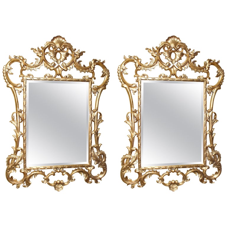 Pair of Ornate Carved Wood Gilt Bevelled Mirrors For Sale at 1stDibs