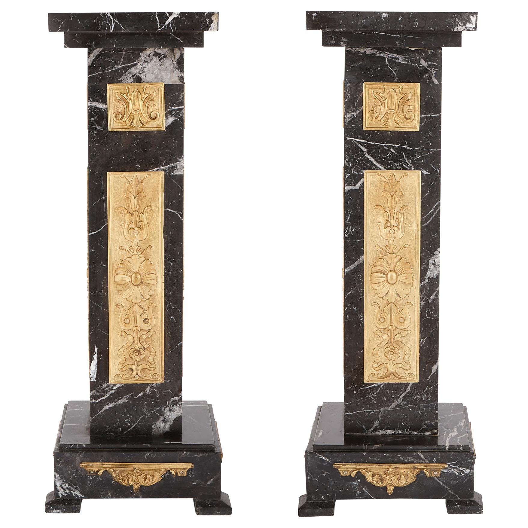 Two Art Deco Black Marble and Gilt Bronze Stands