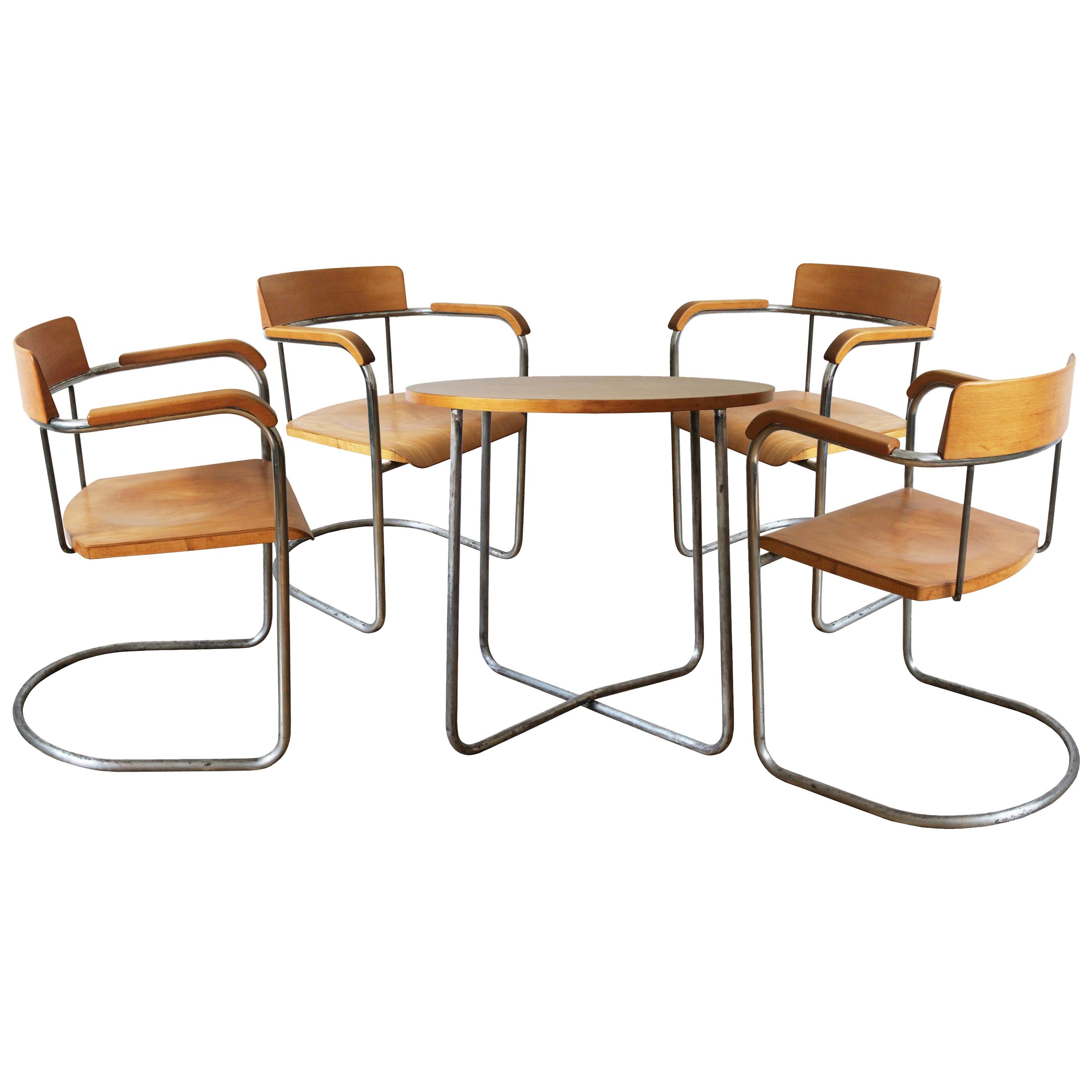 Modernist Dining Set of Four Chairs and Table by the Vichr Company For Sale