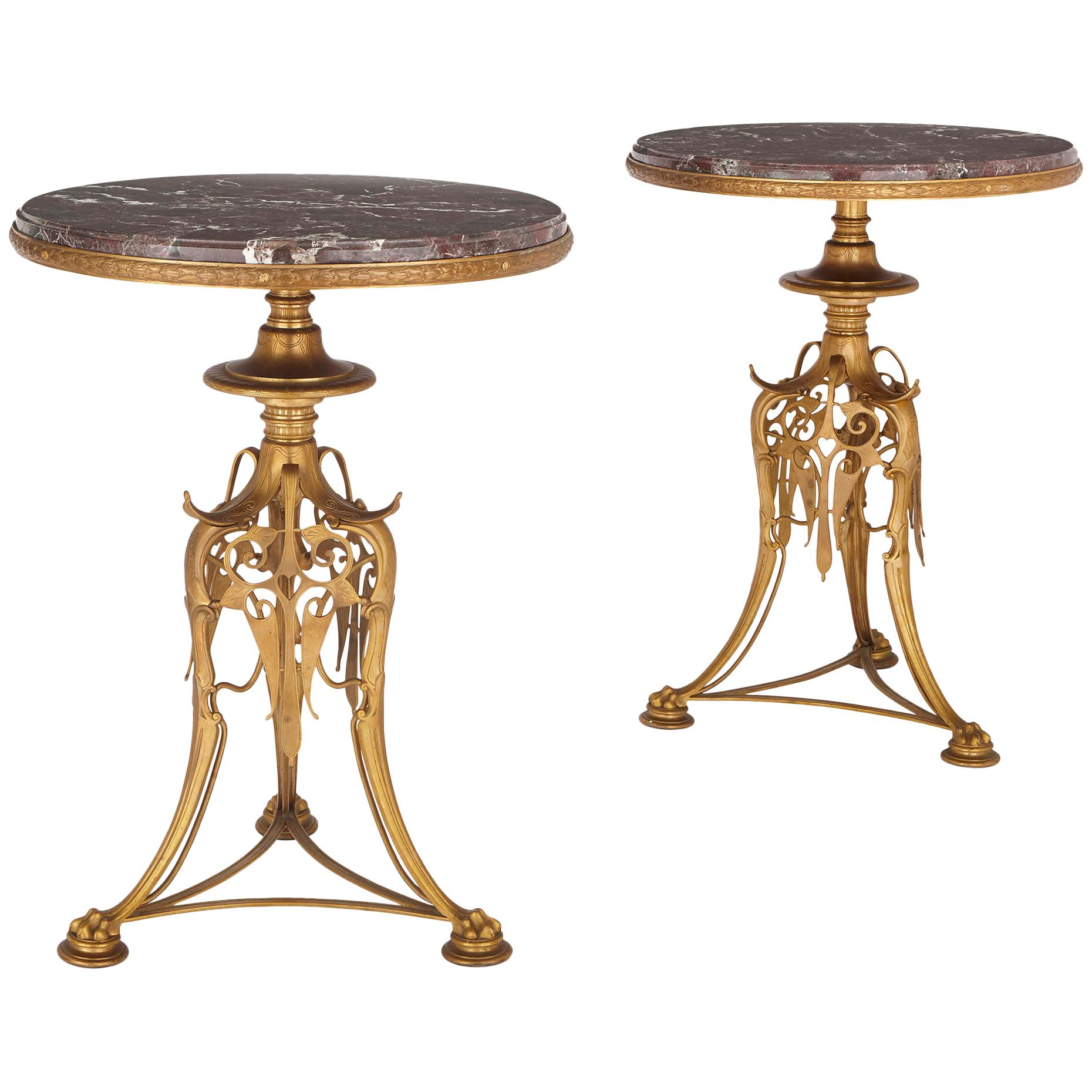 Deux tables rondes en bronze doré et marbre de Barbedienne du 19ème siècle