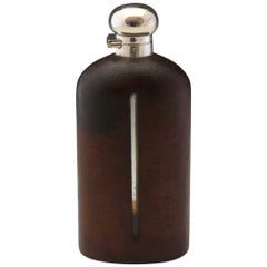 Large Leather Covered Glass Hip Flask with Silver Plated Top, circa 1900