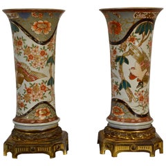 19th Century, Pair of Polychrome Imari Porcelain Vases on Gilt Bronze Bases.