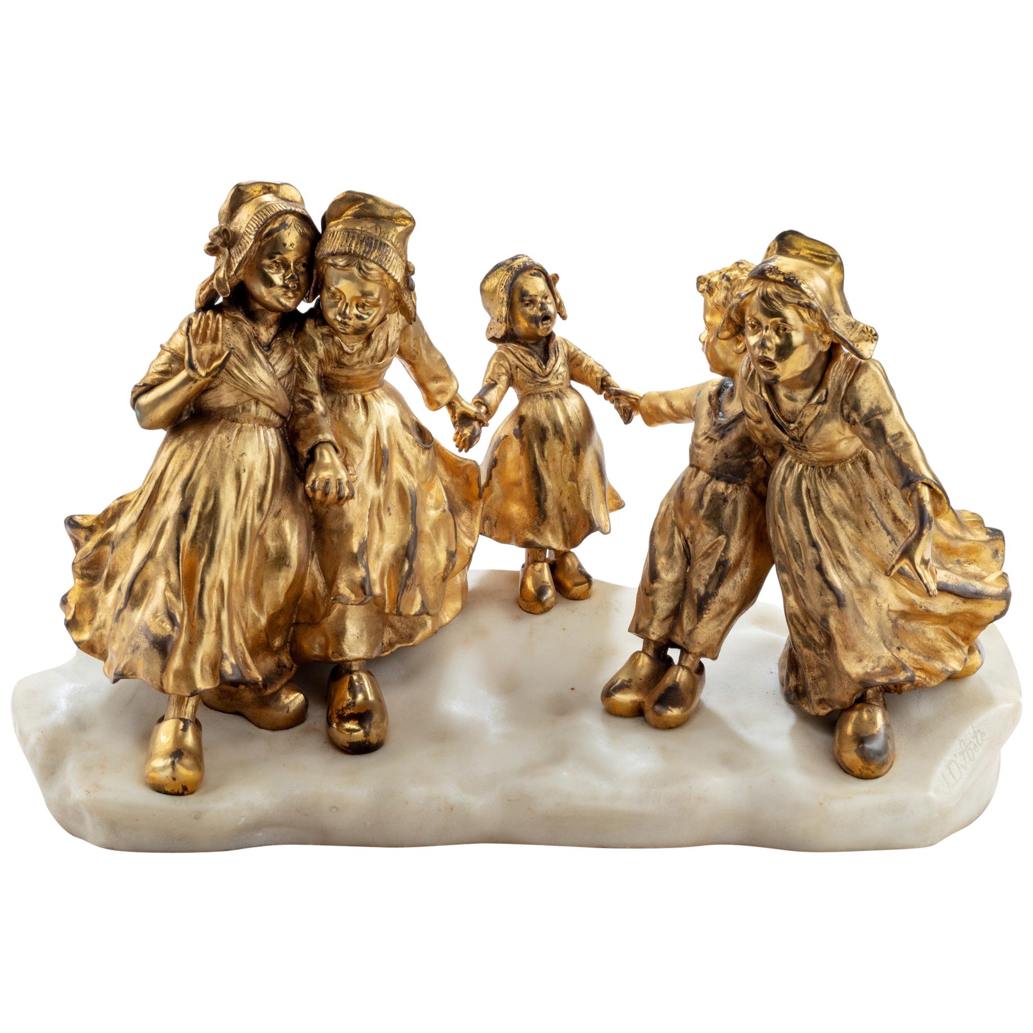 A charming gilt bronze group of Dutch children by Guiseppe or Joseph D’Aste For Sale