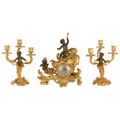 Louis XV Style Gilt and Patinated Clock Set, Attributed to Linke
