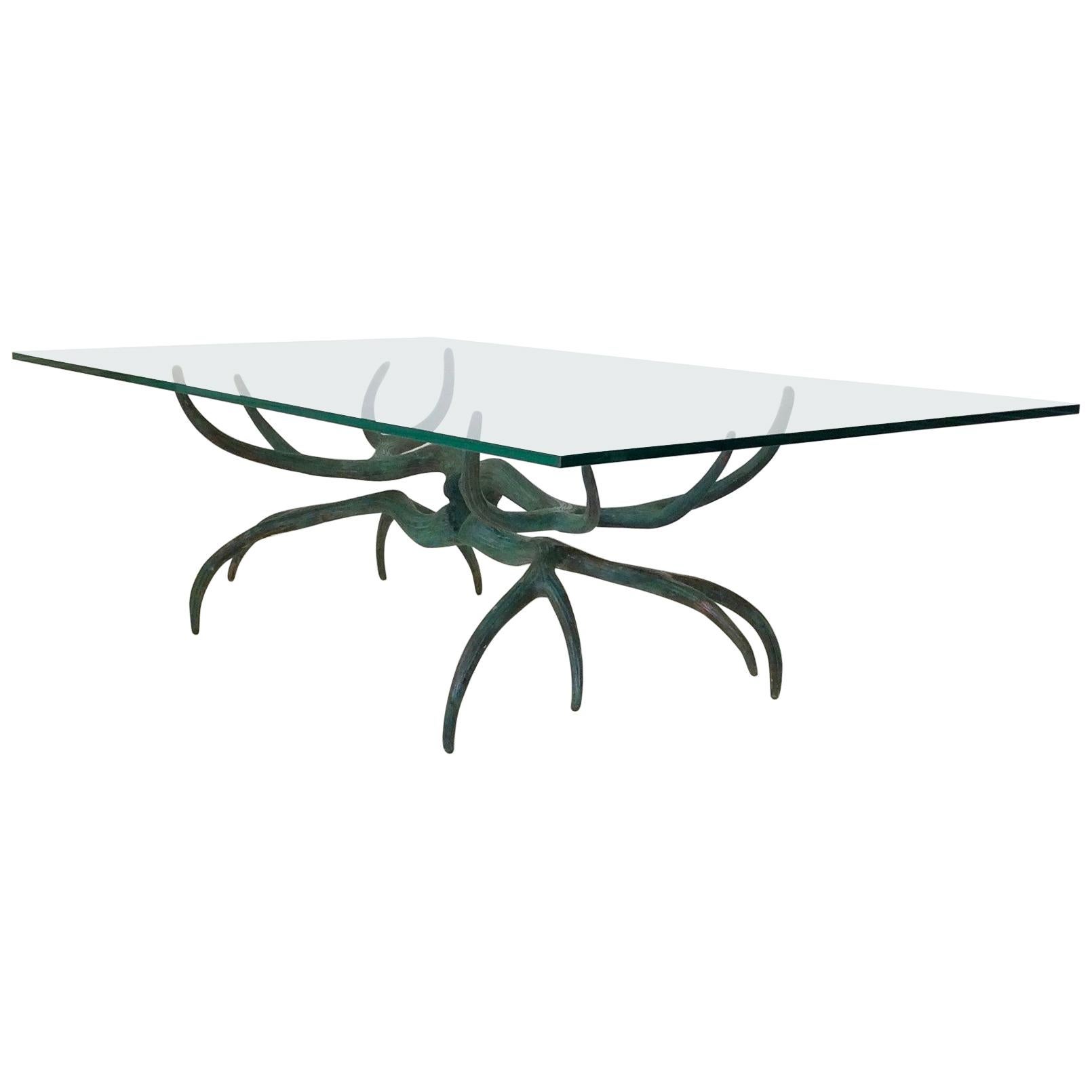 Sculptural deer antlers bronze coffee table, circa 1970, France.
Patinated bronze and rectangular clear glass top.
Dimensions: 140 cm W, 76 cm D, 42 cm H. Glass 16 mm thick.
Good original condition.
All purchases are covered by our Buyer Protection