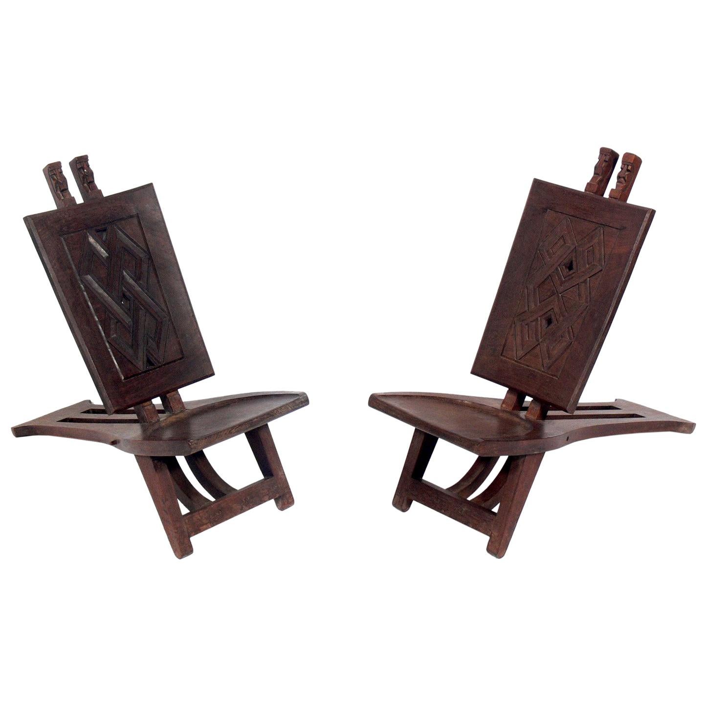 Pair of Low Slung Hand Carved African Lounge Chairs