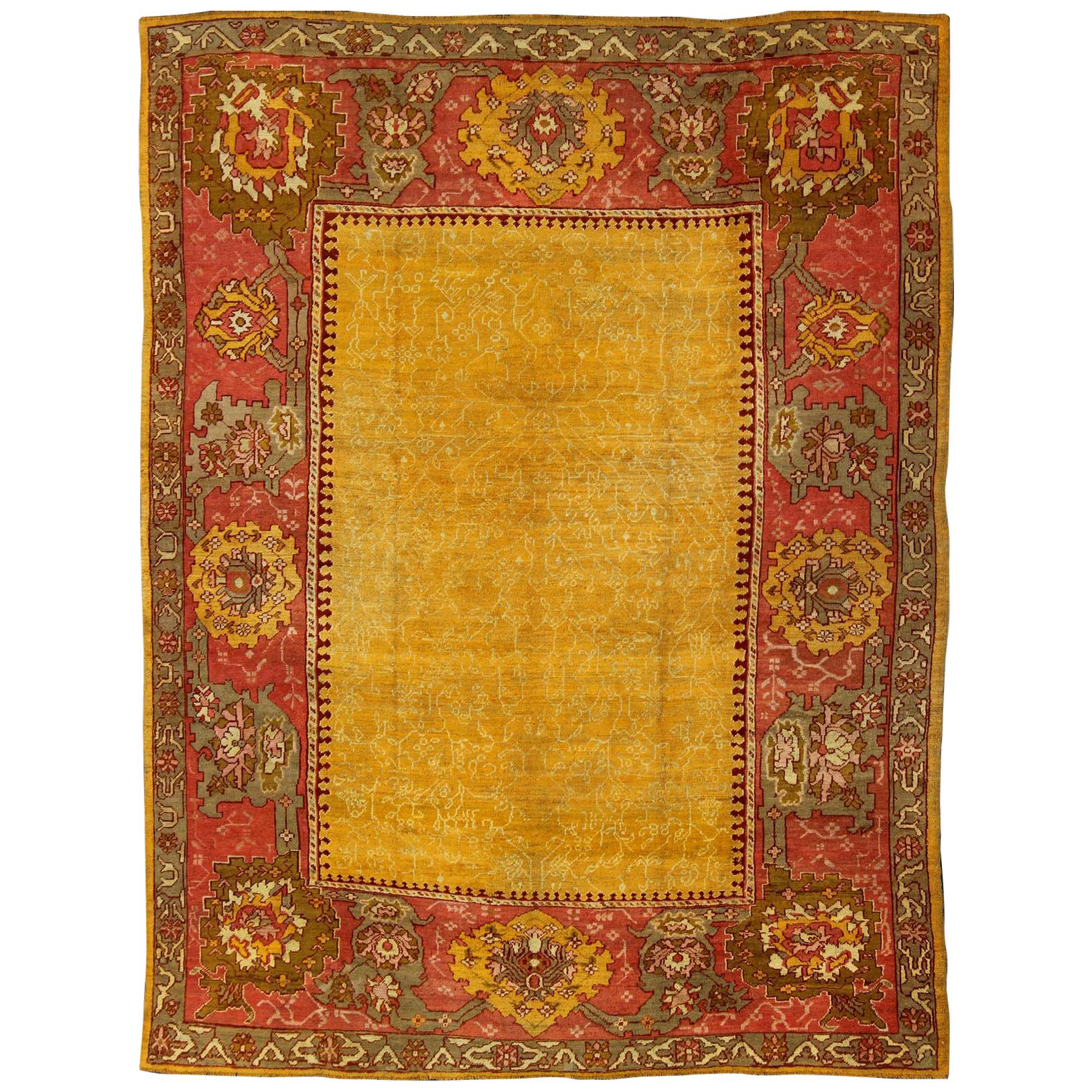 Antique Turkish Oushak rug in gold background, Rose Border & Green 