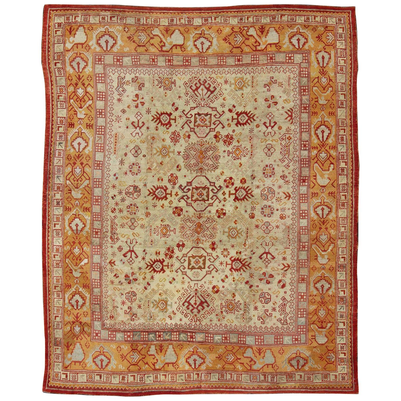 Antique Turkish Oushak Carpet With All-Over Design In Red, Taupe, and Orange For Sale