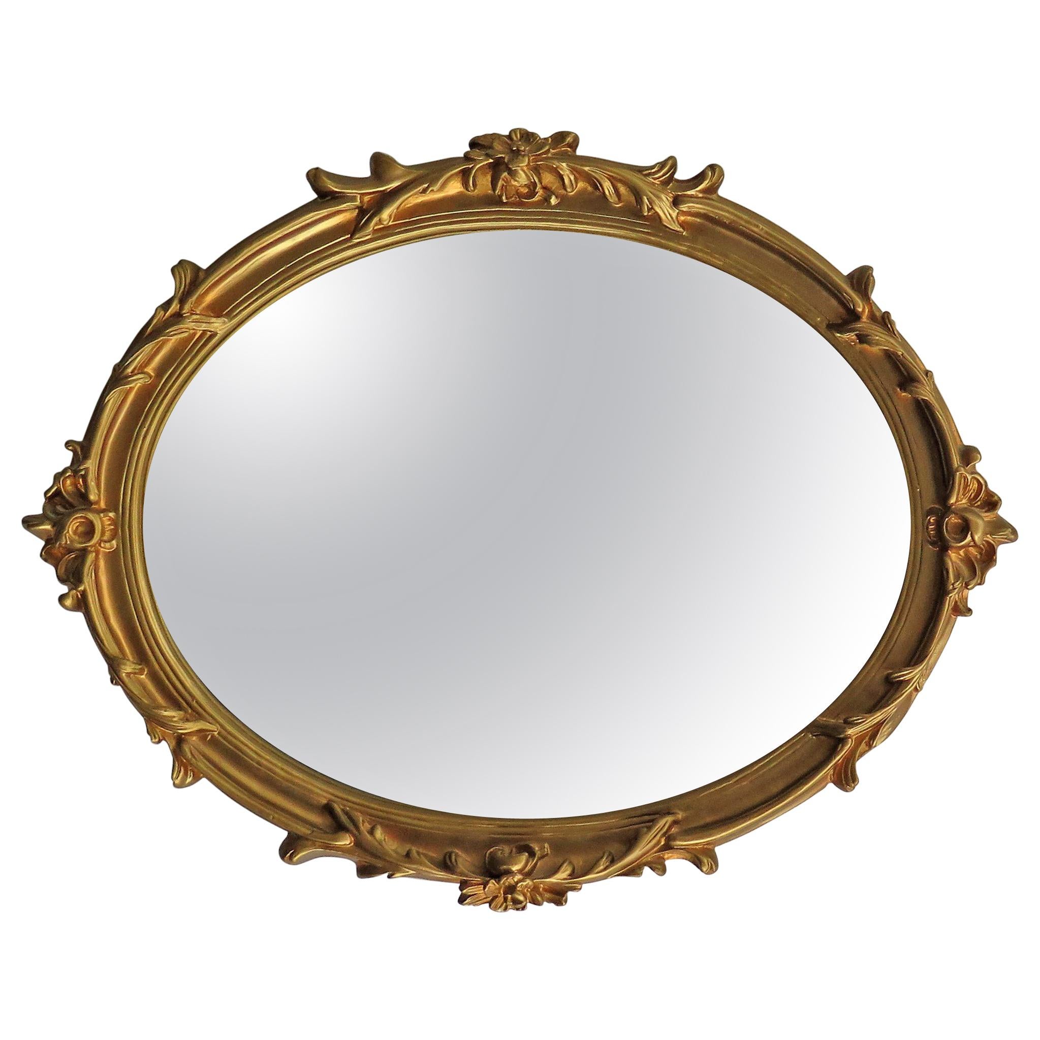 Oval Wall Mirror with Rococo Gold Finish Frame of Gesso on Wood, circa 1930