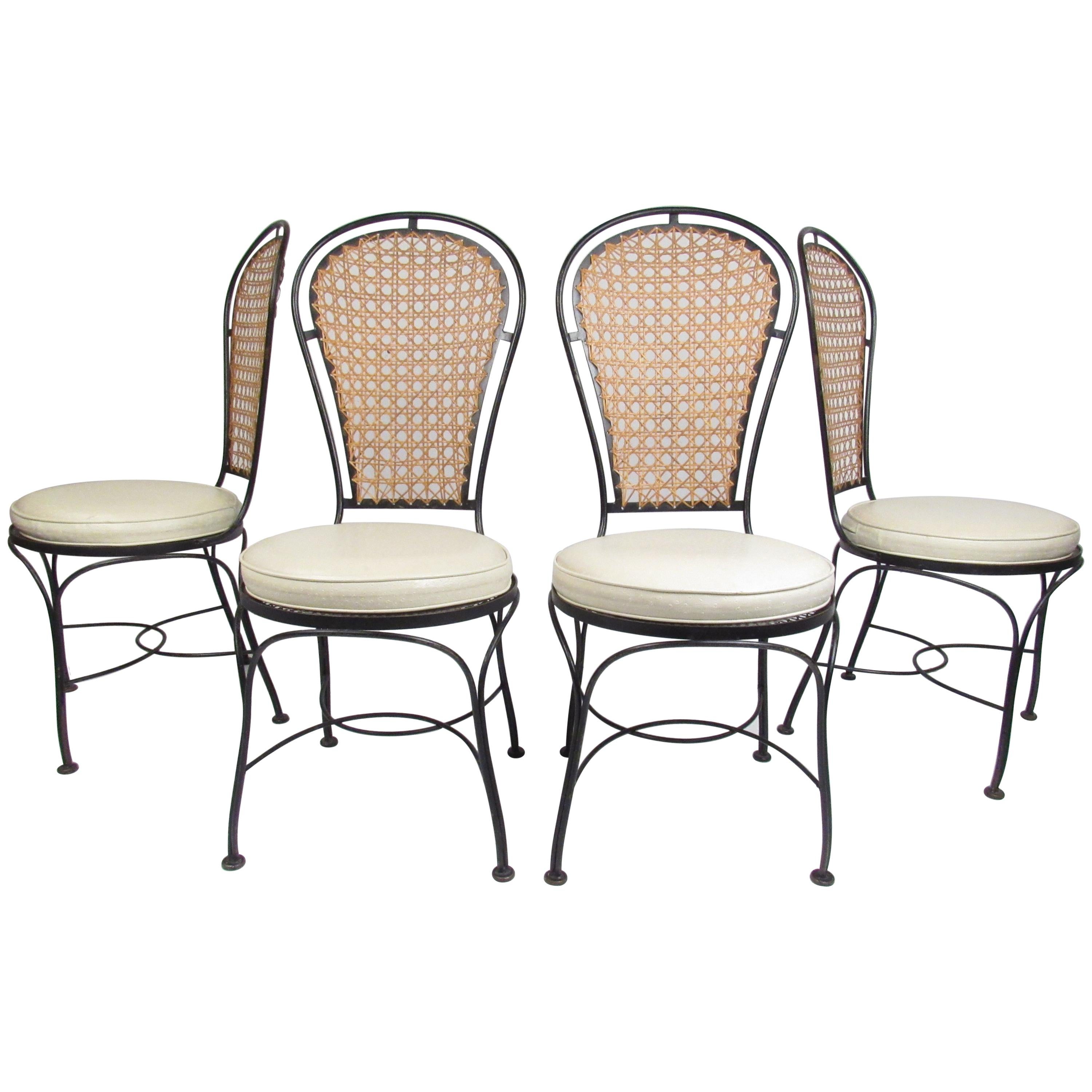 Set of Four Midcentury Wrought Iron Dining Chairs with a Cane Backrest