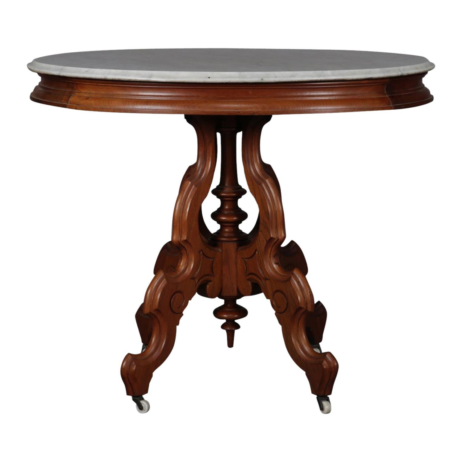 Victorian Carved Walnut Marble-Top Oval Center Table, circa 1890