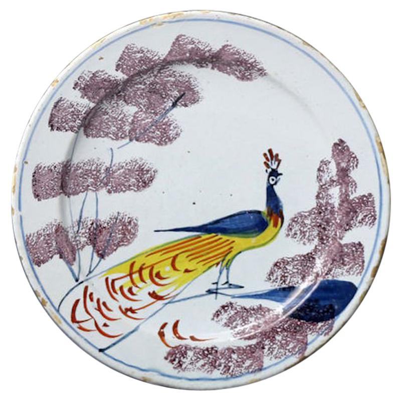 18th Century English Delftware Pottery Polychrome Decorated Plate with Peacock For Sale