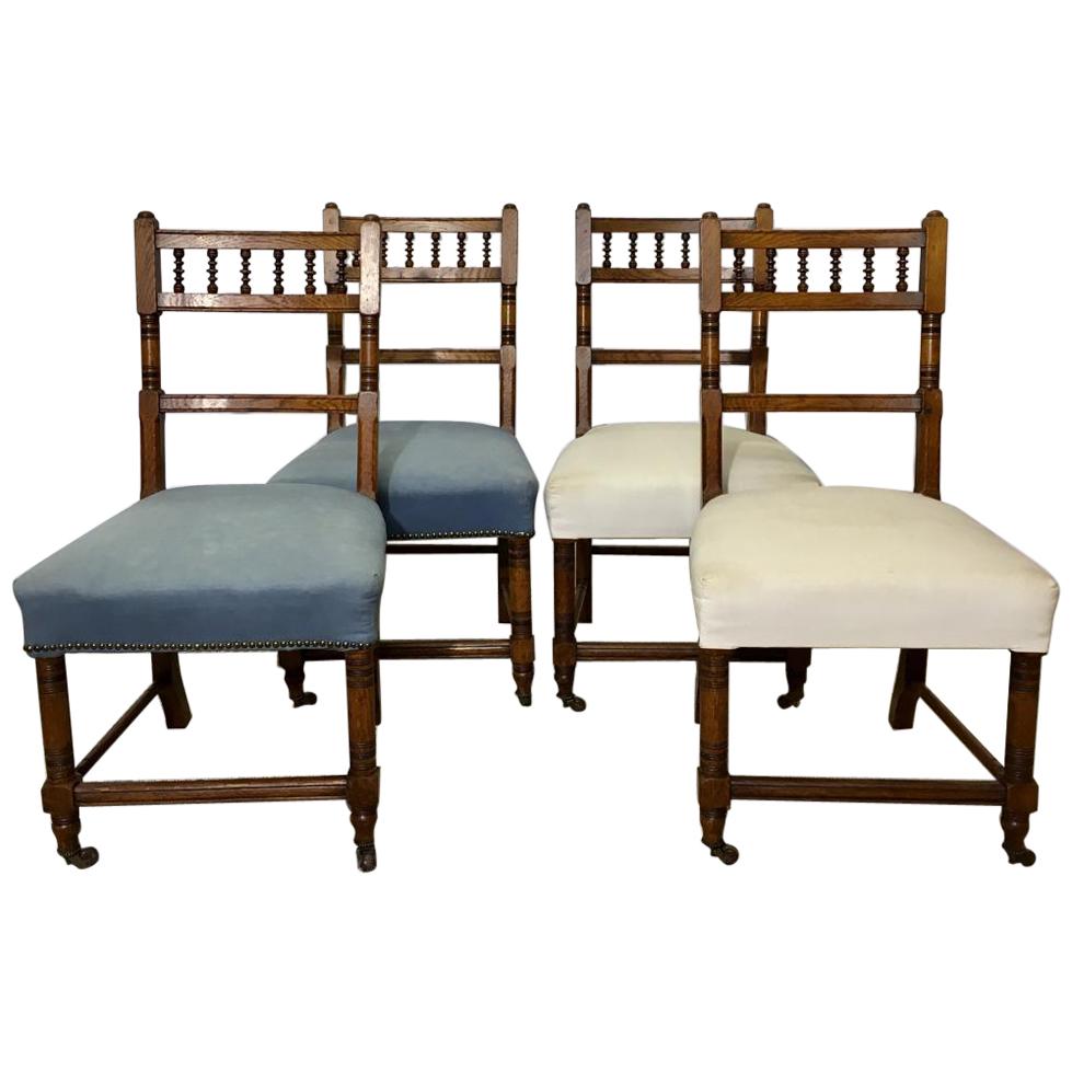 Set of Four Antique Carved Oak Chairs on Wheels For Sale