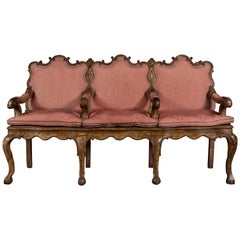 A 17th Century Italian Walnut Three-Seat Divano Upholstered in Pink Silk